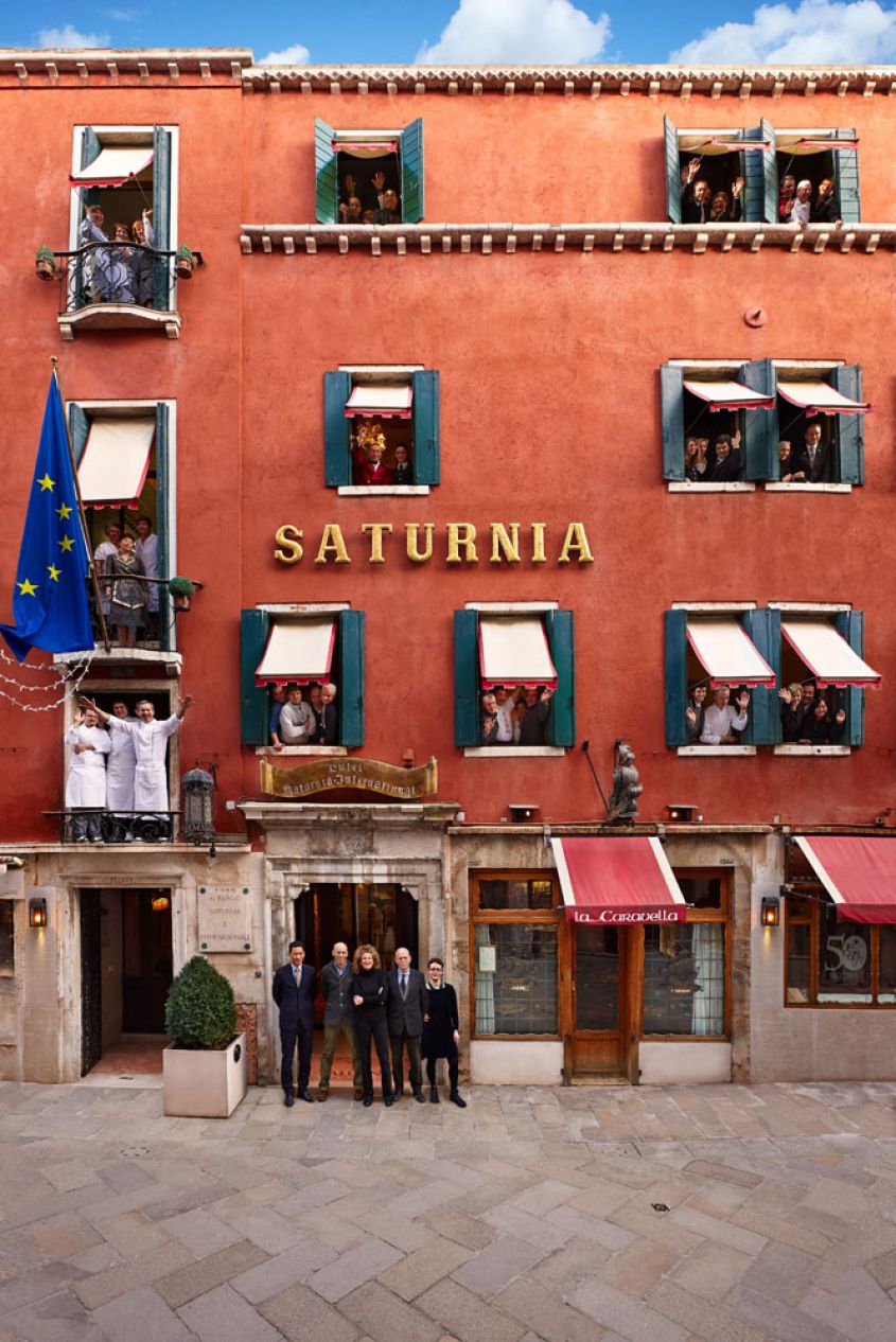Staff and façade of Hotel Saturnia & International